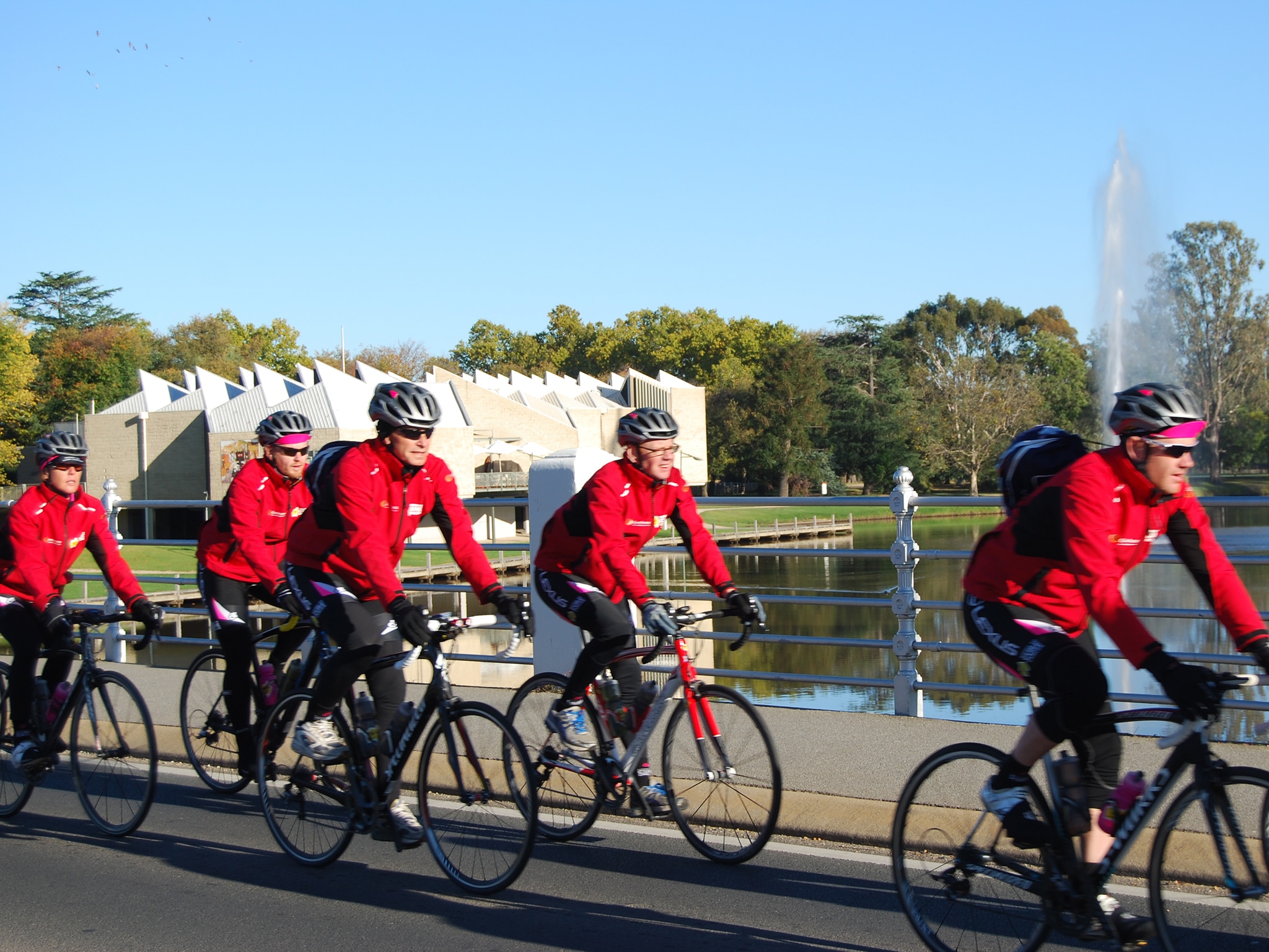 Road cyclists riding past Lake Benalla